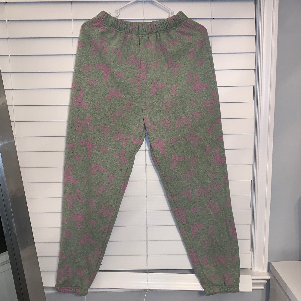 grey sweats w neon pink butterfly’s